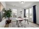 Bright office space featuring a modern desk, chair, and natural light from a large window at 13860 Ash Cir, Thornton, CO 80602