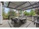 Cozy outdoor deck with pergola, dining table, seating and grill at 18056 E Bellewood Dr, Aurora, CO 80015
