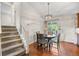 Cozy dining area featuring hardwood floors, modern lighting and glass sliding doors to the outdoor patio at 18056 E Bellewood Dr, Aurora, CO 80015
