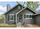 Close up view of the gray single-Gathering home featuring a welcoming front entrance with decorative planters at 18056 E Bellewood Dr, Aurora, CO 80015