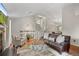 Spacious living room with hardwood floors, comfortable seating, and a staircase to the second floor at 18056 E Bellewood Dr, Aurora, CO 80015