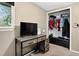 Bedroom featuring a desk, closet with clothing, and a window with natural light at 8340 London Ln, Conifer, CO 80433