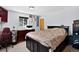 Comfortable bedroom with natural light, desk, and closet at 8340 London Ln, Conifer, CO 80433