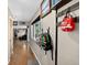 Inviting hallway featuring wood floors, coat rack, and view into living room at 8340 London Ln, Conifer, CO 80433