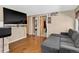 Spacious living room with hardwood floors and a comfortable gray couch at 8340 London Ln, Conifer, CO 80433