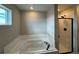 Bathroom with soaking tub and separate shower at 9353 Yampa Ct, Commerce City, CO 80022