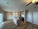 Open kitchen with island and stainless steel appliances at 9353 Yampa Ct, Commerce City, CO 80022