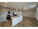 Modern kitchen with stainless steel appliances and island at 9353 Yampa Ct, Commerce City, CO 80022