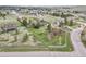 Aerial view of a single-Gathering home, featuring a fenced yard, mature trees and quiet neighborhood streets at 34101 Columbine E Trl, Elizabeth, CO 80107