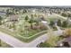 Aerial view of single-Gathering home on a corner lot with mature landscaping, trees and a fenced yard at 34101 Columbine E Trl, Elizabeth, CO 80107