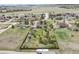 Aerial view of a single-Gathering home with mature trees, a fenced yard, a chicken coop, and shed at 34101 Columbine E Trl, Elizabeth, CO 80107