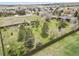 Aerial view of single-Gathering home with fenced yard, mature trees, landscaping and a shed at 34101 Columbine E Trl, Elizabeth, CO 80107