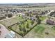Aerial view of single-Gathering home with fenced yard, mature trees and landscaping in a quiet neighborhood at 34101 Columbine E Trl, Elizabeth, CO 80107