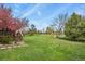 Spacious backyard featuring a large, well-maintained lawn and play area at 34101 Columbine E Trl, Elizabeth, CO 80107