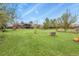 Beautifully maintained backyard and lawn featuring mature trees and a playground at 34101 Columbine E Trl, Elizabeth, CO 80107