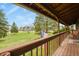 Enjoy tranquil views from this balcony, complete with a charming American flag, overlooking a lush landscape at 34101 Columbine E Trl, Elizabeth, CO 80107