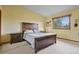 Bedroom with a bed, matching nightstands, and natural light streaming through the windows at 34101 Columbine E Trl, Elizabeth, CO 80107