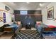 Shared bedroom featuring two beds, a modern design, and a black accent wall at 34101 Columbine E Trl, Elizabeth, CO 80107