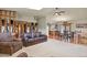 Inviting living room with hardwood floors, a ceiling fan, and seamlessly connects to the open kitchen at 34101 Columbine E Trl, Elizabeth, CO 80107