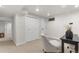 Finished basement area with neutral carpet, closet, light gray paint, and dark furniture at 6511 S Cedar St, Littleton, CO 80120