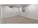 Carpeted basement with recessed lighting and small windows for natural light at 6511 S Cedar St, Littleton, CO 80120