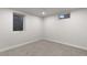Finished basement featuring neutral walls and carpet with a window and recessed lighting at 6511 S Cedar St, Littleton, CO 80120