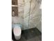 Contemporary bathroom showcasing a modern toilet and a sleek glass-enclosed shower with marble tiling at 6511 S Cedar St, Littleton, CO 80120
