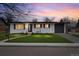 Charming single-story home featuring a well-manicured lawn and an attached one-car garage at 6511 S Cedar St, Littleton, CO 80120
