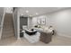 Bright living room with modern decor, neutral furniture, and a stylish area rug at 6511 S Cedar St, Littleton, CO 80120