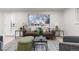 Bright living room featuring stylish seating, a large window, and modern decor at 6511 S Cedar St, Littleton, CO 80120