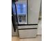 Stylish refrigerator with a water and ice dispenser, adding convenience to the modern kitchen at 6511 S Cedar St, Littleton, CO 80120