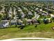 Aerial view of the property's backyard and surrounding neighborhood of single Gathering homes at 22501 E Belleview Pl, Aurora, CO 80015