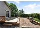 Private backyard featuring mature landscaping, a brick patio and deck at 22501 E Belleview Pl, Aurora, CO 80015