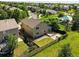 Aerial view of a well-kept backyard with green lawn, wood deck, patio and lush flower beds at 22501 E Belleview Pl, Aurora, CO 80015