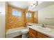 Bathroom with tub/shower combination, toilet and vanity with sink for convenient functionality at 22501 E Belleview Pl, Aurora, CO 80015