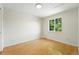 Comfortable bedroom bathed in natural light featuring hardwood floors and neutral colors at 22501 E Belleview Pl, Aurora, CO 80015