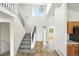Inviting foyer with tile flooring and staircase leading to the second floor at 22501 E Belleview Pl, Aurora, CO 80015