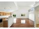 Spacious living area featuring hardwood floors, bright light, and open-concept design to the kitchen at 22501 E Belleview Pl, Aurora, CO 80015