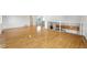 Open loft area featuring hardwood floors, wrought iron railing and an abundance of natural light at 22501 E Belleview Pl, Aurora, CO 80015
