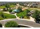 Aerial view of a neighborhood park with playground next to new home construction at 22501 E Belleview Pl, Aurora, CO 80015