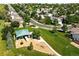 Aerial view of a neighborhood park featuring a playground with swings, slides, and picnic area at 22501 E Belleview Pl, Aurora, CO 80015