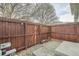 Private backyard with wood fence and small patio area at 16373 E 17Th Pl # B, Aurora, CO 80011