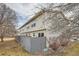 Rear exterior view of the house with gray fence at 16373 E 17Th Pl # B, Aurora, CO 80011