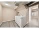 Basement laundry room with washer, dryer, and storage at 16373 E 17Th Pl # B, Aurora, CO 80011