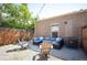 Private backyard with patio seating, gravel, and wood fence at 2645 W 24Th Ave, Denver, CO 80211