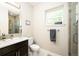 Modern bathroom with sleek vanity, tiled shower, and plenty of natural light at 2645 W 24Th Ave, Denver, CO 80211