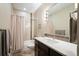 Well-lit bathroom with modern fixtures, sleek vanity, and shower with glass door at 2645 W 24Th Ave, Denver, CO 80211