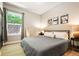 Serene bedroom features a large window, hardwood floors, and soft lighting at 2645 W 24Th Ave, Denver, CO 80211