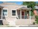 Charming home exterior with a red front door, white railing, and classic stone facade at 2645 W 24Th Ave, Denver, CO 80211