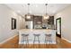 Well-appointed kitchen with granite countertops, dark cabinetry, and stainless-steel appliances at 2645 W 24Th Ave, Denver, CO 80211
